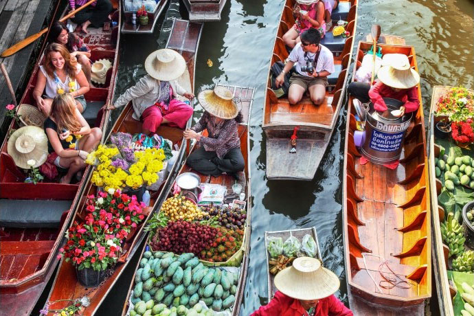 Damnoen Saduak Floating Market One of the largest and last remaining floating markets in Thailand, this authentic market has entranced travelers and photographers the world over with traditional life along the canel 32 kilometers from long-tailed boats or rowing boats